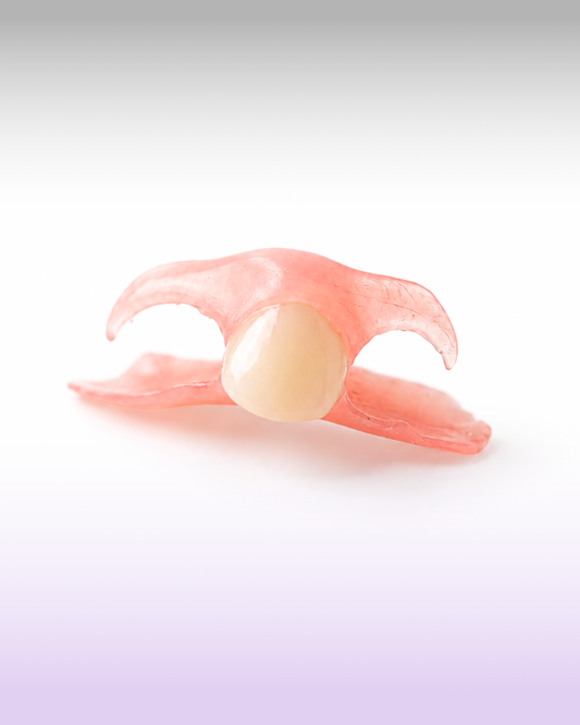 A fexible flipper partial denture for a missing upper tooth, presented on a purple gradient background